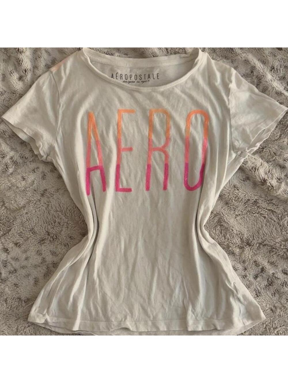 aéropostale white cotton baby tee with pink/orange gradient text